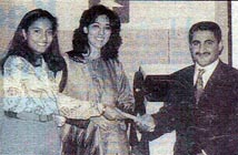 Poonam Datta Maersk Line and Michelle Mascarenhas Polaris, presenting a prize to Ali.